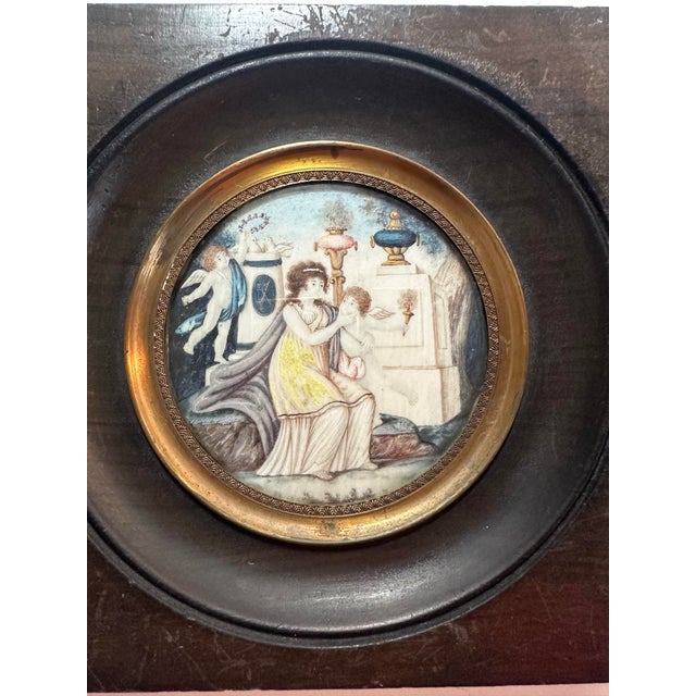 This exquisite pair of 19th-century hand-painted miniatures captures the elegance and symbolism of the Neoclassical era in...