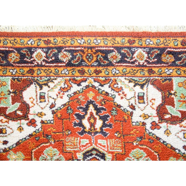 A chic late 20th century American hand-knotted Keristan rug with a Heriz-style pattern including a large central floral...