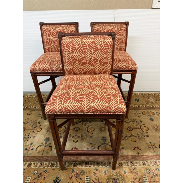 Design Plus Gallery presents a Set of Three Paxton Rattan Bar Stools by Ficks Reed. The stools are an interpretation of...