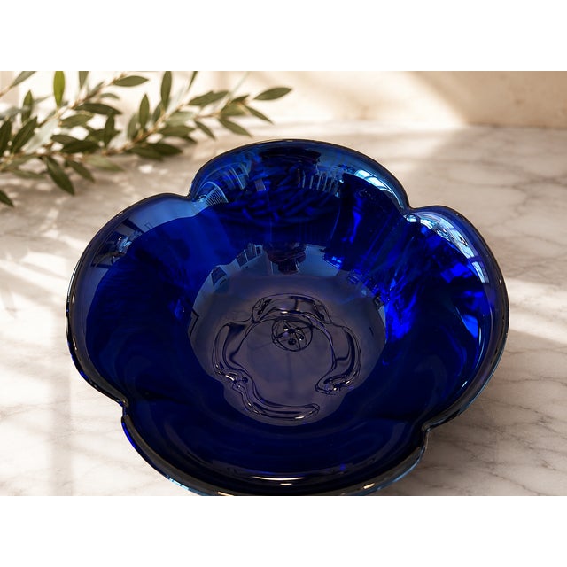 Bring a striking dose of Mid-Century Italian design to your table with this elegant set of four sculptural cobalt blue art...
