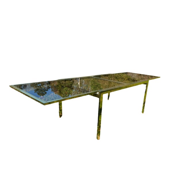 MCM Design Institute of America expandable glass top dining table. Gold chrome and glass attributing to Milo Baughman....