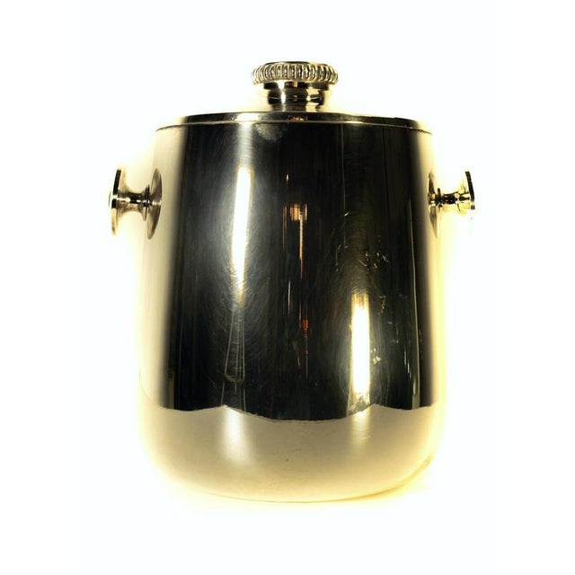 An elegant classic ice bucket with lid by Macabo Milano, Italy in silver guilt metal. Stamped in the bottom. This piece is...