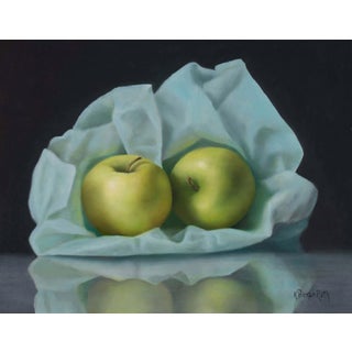 Burrowed in Blue by Kelly Birkenruth | Oil On Panel Still life of green apples on blue fabric For Sale