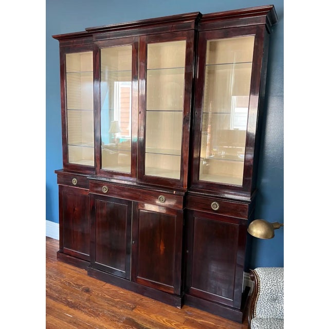 Fine 19th century English regency period Rosewood breakfront bookcase. “Plain and neat” but refined with details such as...