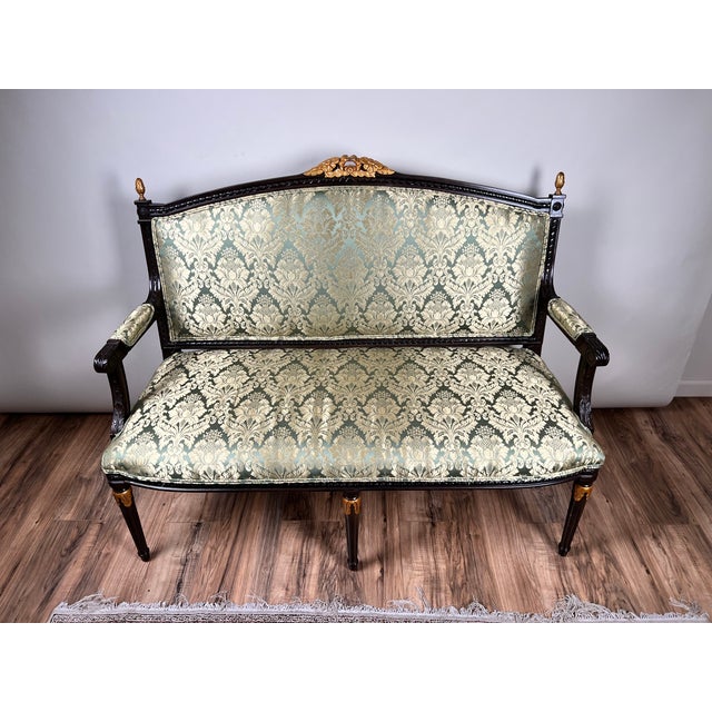 This elegant vintage Louis XVI style settee captures the refined symmetry and classical restraint associated with French...