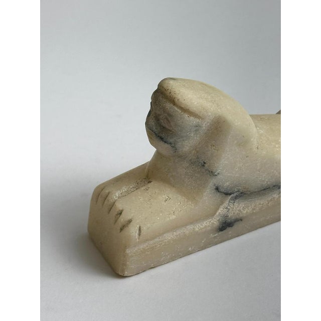 A small yet evocative example of Grand Tour style, this hand-carved alabaster sphinx figurine reflects the fascination...
