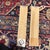 Sought-after matching pair of vintage mid-century Hollywood Regency style narrow rectangular accent wall mirrors featuring...