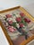 Mid-century European oil on board still life featuring a bouquet of roses arranged in a porcelain vase. Signed E....