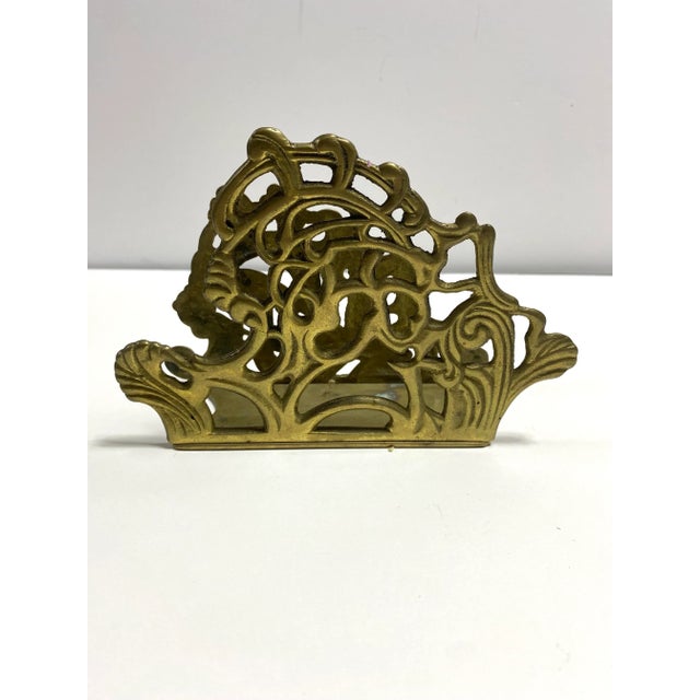Beautiful ornate vintage brass napkin holder or letter holder. A nicely scrolled and weighted solid brass, made in...