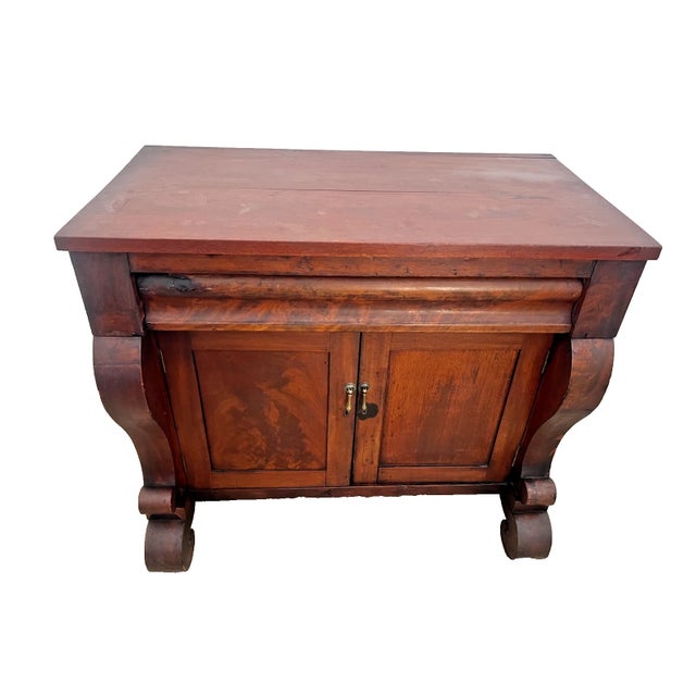Bring timeless historical elegance to your home with this stunning antique Empire style cabinet. Featuring rich wood...
