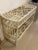 Vintage rattan Chinese chippendale Ficks Reed console table with glass top. Original cream paint and glass top may have...