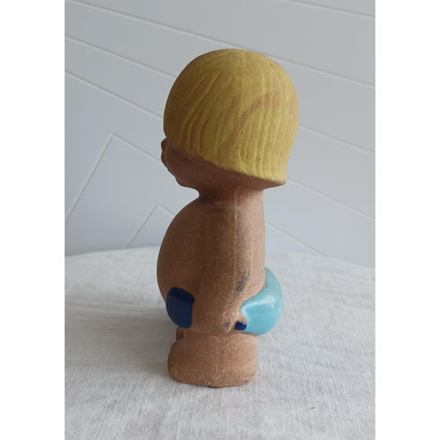 Offered is an authentic vintage stoneware figurine, 'Boy with Bucket,' designed by the renowned Swedish ceramicist Lisa...