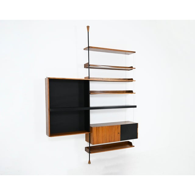 Bookcase containing 6 shelves, a cabinet with a lockable door and 3 drawers, and a cabinet with one shelf. The drawers do...