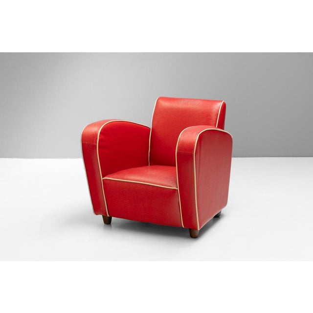 Late 20th Century art deco style armchair in original red leatherette. U.K circa 1980.