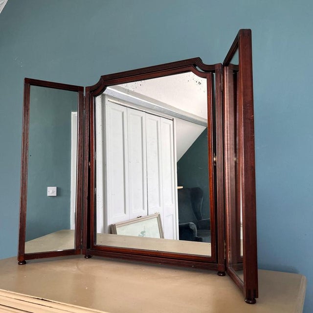 Triptych vintage dark wood mirror with adjustable centre mirror Height 62cm Width of centre mirror 49cm Width of 2 side...