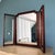 Triptych vintage dark wood mirror with adjustable centre mirror Height 62cm Width of centre mirror 49cm Width of 2 side...