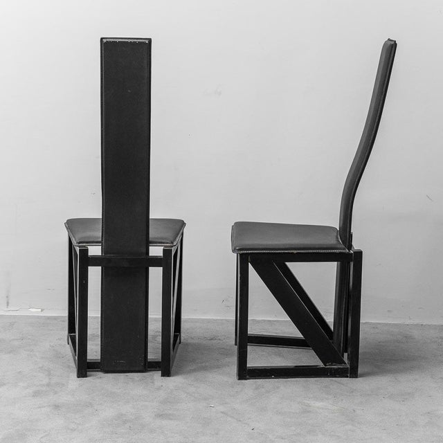 Pair of Edo chairs. Designed by Kisho Kurokawa for PPM. Wooden frame with leather seat and back. Produced in the 1980s....