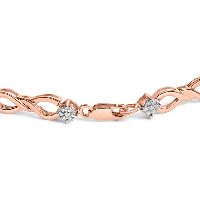 Elegant and timeless, this gorgeous two tone 10K yellow gold coated sterling silver link bracelet features 0.50 carat...