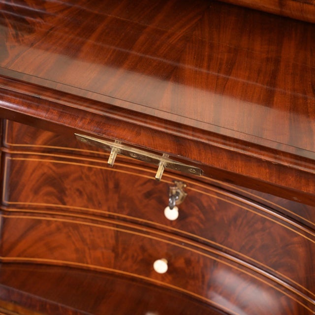 Cylinder secretary with attachment Northern Germany around 1830 very beautiful pyramid mahogany applications made of brass...