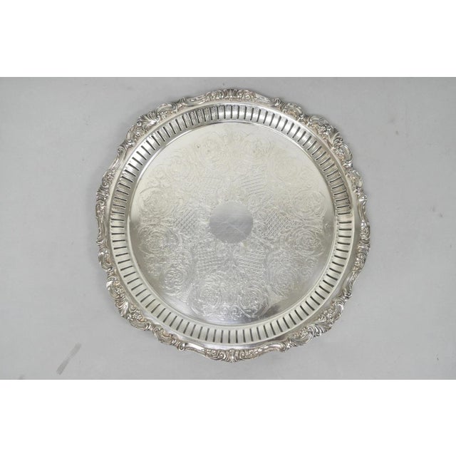 Vintage Baroque by Wallace Silver Plated 297 Round Footed Serving Platter Bar Tray. Circa Mid 20th Century. Measurements:...