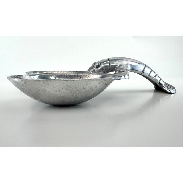 Vintage cast aluminum double serving dish formed as a stylized lobster with two integrated bowls and a sculptural tail...