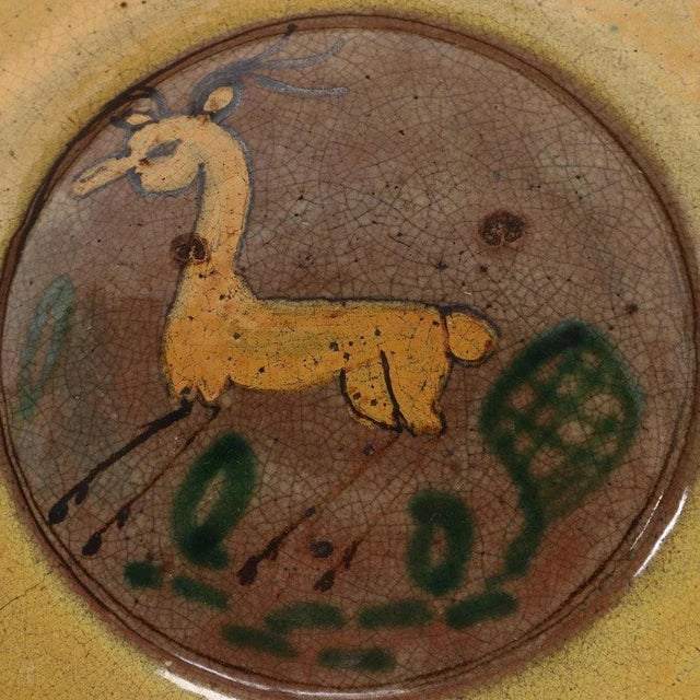 Spanish Colonial revival earthenware plate from Guatemala features delightful, hand painted wildlife in a folk art style....