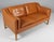 Børge Mogensen two-seat sofa with original cognac leather upholstery. Legs of oak. Model 2212, made by Fredericia...