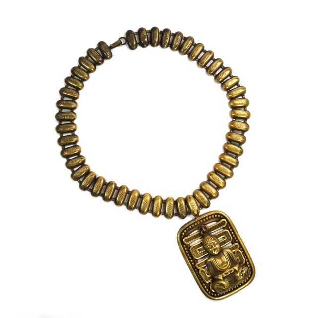 Vintage designer Asian-motif gold-plated necklace by Joseff of Hollywood 1940s. A wide link chain of flattened lozenges...