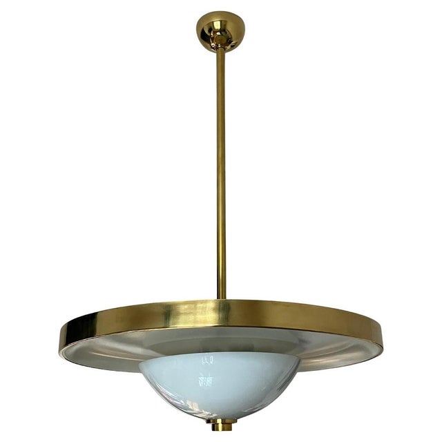 Large elegant bauhaus chandelier designed by franta anyz and executed by ias in the 1930s, featuring a broad brass ring...