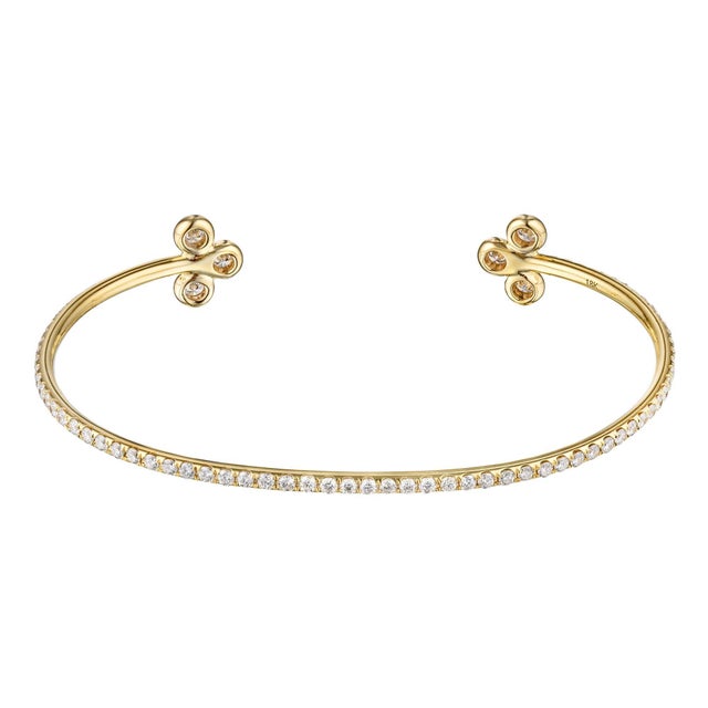 Diamond open bangle bracelet in 18K yellow gold. Pave set brilliant round diamonds are F-G VS1-VS2. Carat weight: 1.75 ct....