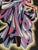 Handwoven wool tapestry depicting a stylized female figure in motion, rendered in a bold Cubist and Art Deco-inspired...