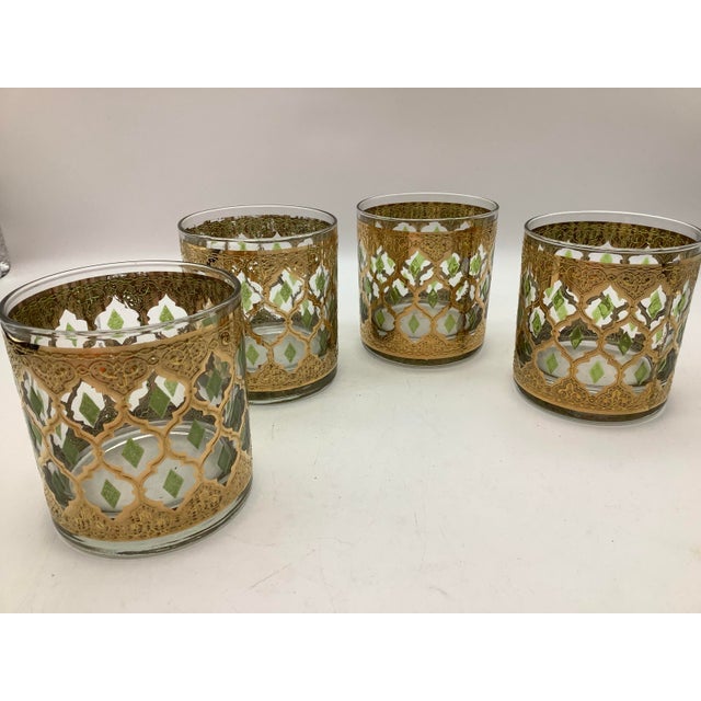 Culver Valencia 22kt gold and green diamond cocktail glass set of 4. The glasses show wear including minor scratches,...