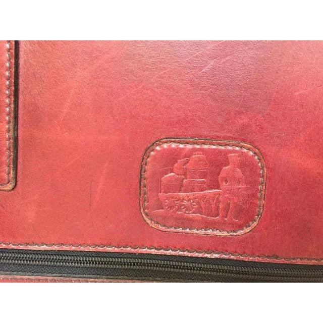 Vintage leather suitcase "La Bagagerie Paris" burgundy bordeaux luggage. Maroon leather travel bag with zip around and...