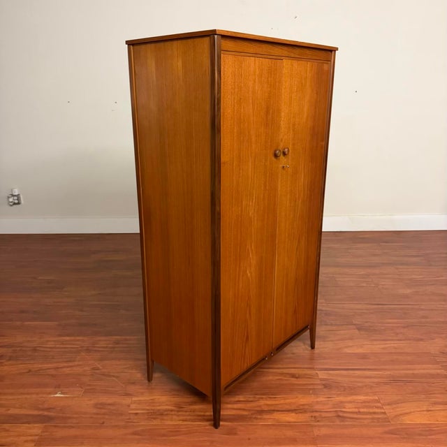 Vintage mid-century teak wardrobe / armoire by A. Younger Furniture, made in the U.K. circa 1960's. This piece would be...