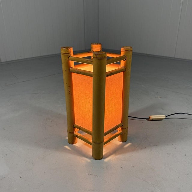 Lovely rattan table lamp. Rattan frame with fabric screens. 1 small (E14) screw fitting. 1970’s. In good condition with...