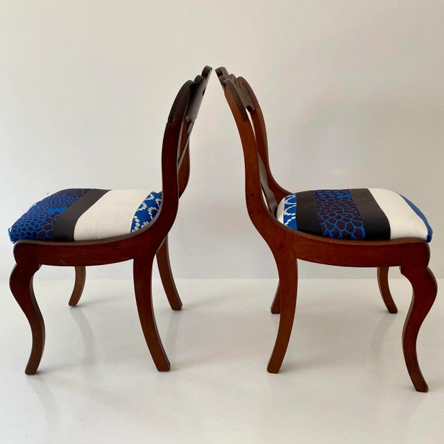 Attributed to Thomas Day this stunning pair of carved mahogany side chairs were created in North Carolina circa 1850s in a...