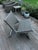 A single Arden Adirondack chair from CO9 Design, crafted from natural teak with a woven grey synthetic wicker seat and...