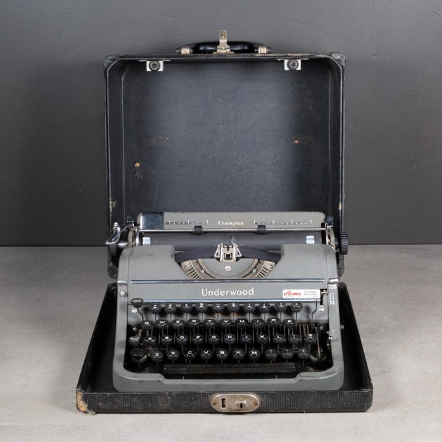ABOUT A vintage portable Underwood Champion Four bank typewriter in grey finish and original case. This typewriter is very...