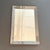 This large, mid-century shadowbox wall mirror is circa the 1940s. The mirror features a sleek, straight edge, 4" wide,...