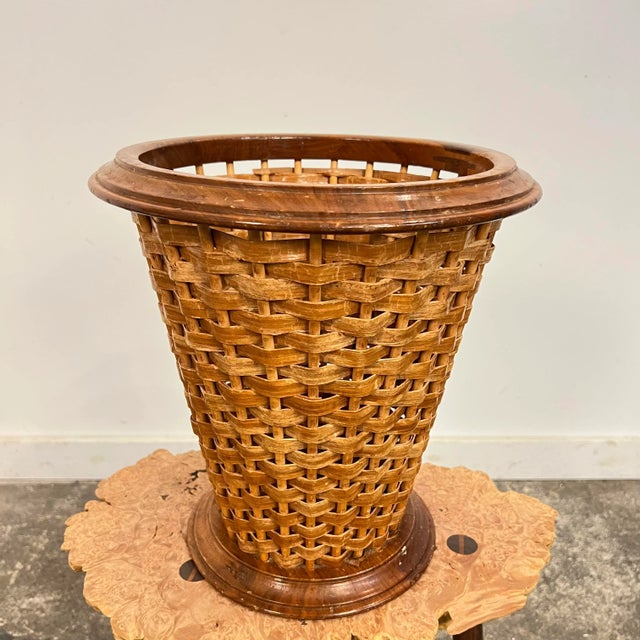 Late mid-century (1970s) woven wastebasket by Rude Osolnik is constructed out of Appalachian black walnut wood and...