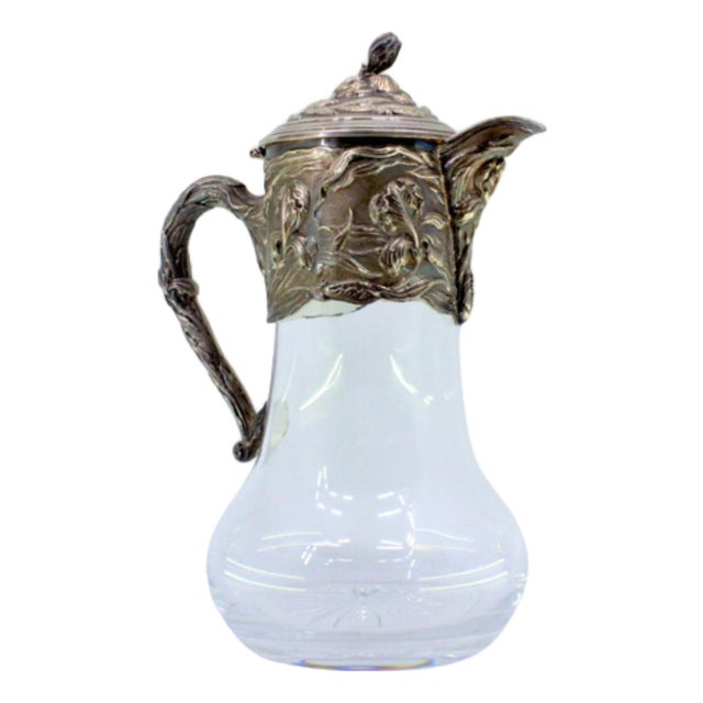 Wine Jug with Smooth Glass Body and Embossed Silver Application, with Floral Motifs and Flower-Shaped Knob Lid For Sale