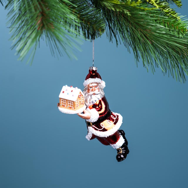 Bring holiday magic to your Christmas tree with this charming Glass Santa with Gingerbread Ornament Set. Featuring a...