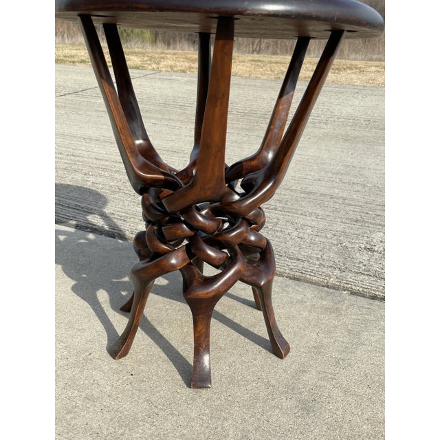 Hand carved interlocking wood sculpture. Skillfully carved from a single piece of wood.