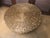 Large 42” round woven rattan coffee table with floating/movable wooden table top. Sitting on four large wooden supports...