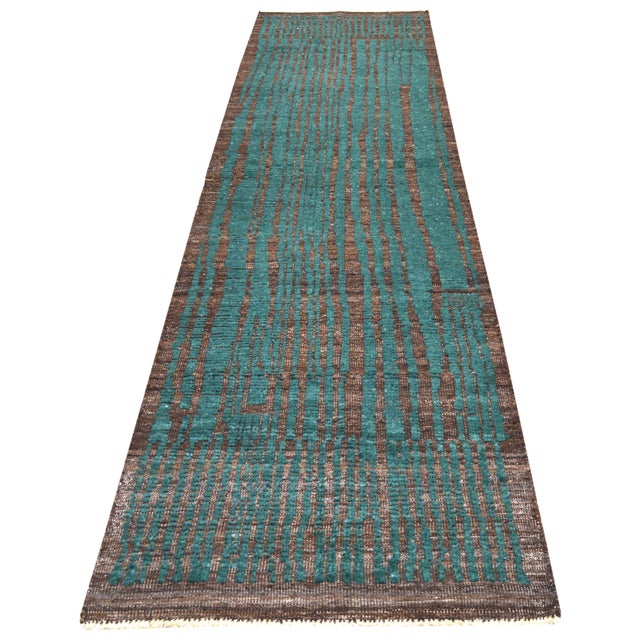 Hand-knotted with care using traditional rug-making techniques, this wool rug blends timeless craftsmanship with a modern...