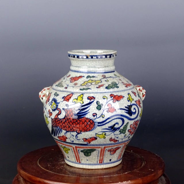 W-26cm,H-26.6cm This product is a vintage blue and white porcelain jar with a hand-painted phoenix pattern, originating...