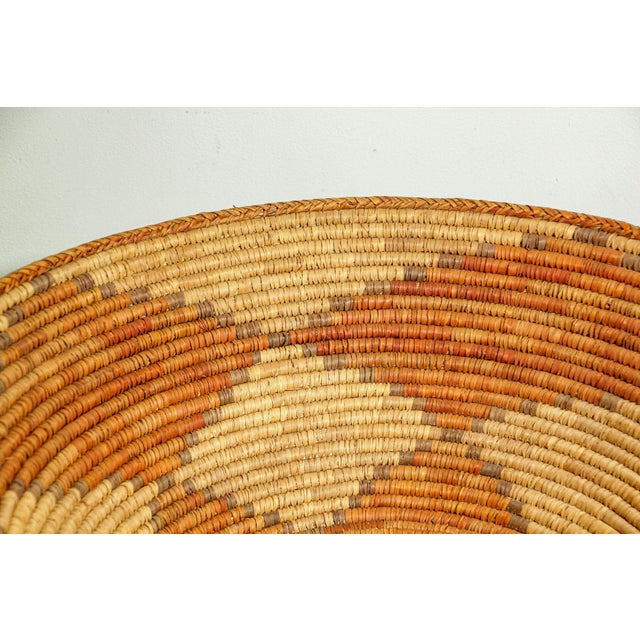 Large vintage traditional hand coiled American Western basket. This tightly hand woven willow basket showcases talent and...