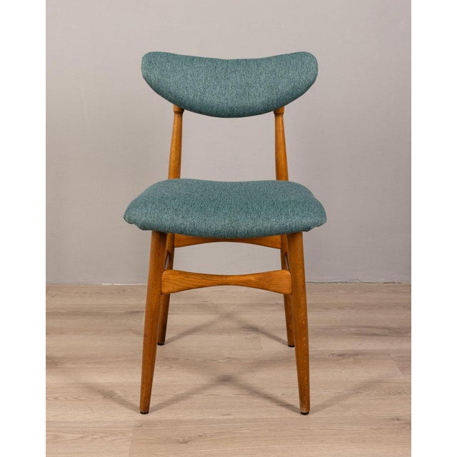 Pair of chairs with wooden structure with seat and back covered in green fabric, Italian design, 1960s.