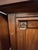 Elegant vintage-style buffet cabinet featuring rich warm wood tones, carved accent details, and a timeless classic design....