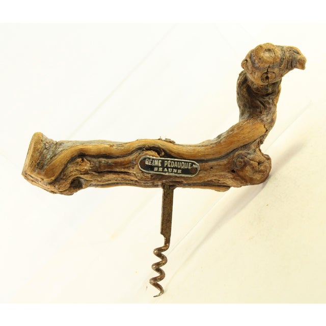 A very collectible French advertising corkscrew Made from the recycled burlwood of the grapevines from the stock of Reine...